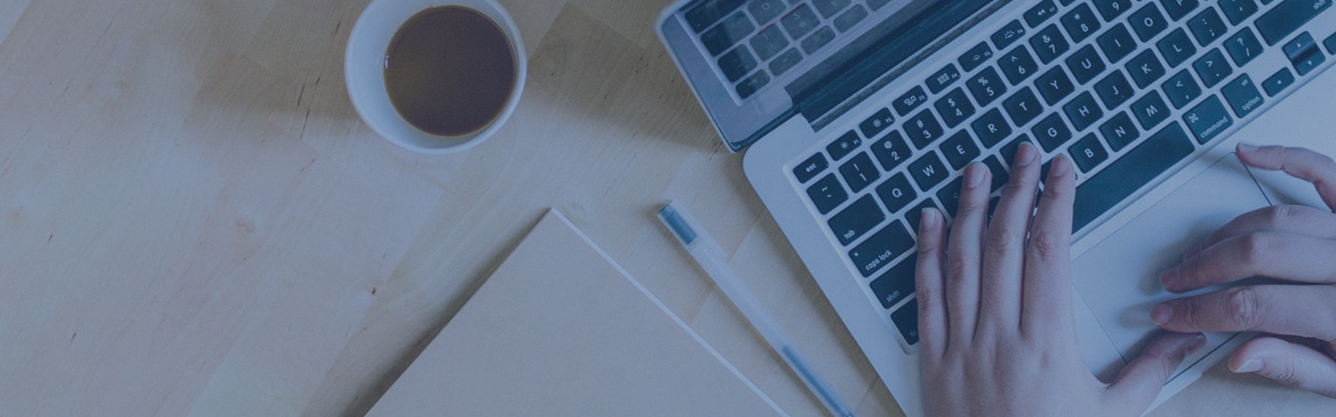 Someone typing on a laptop